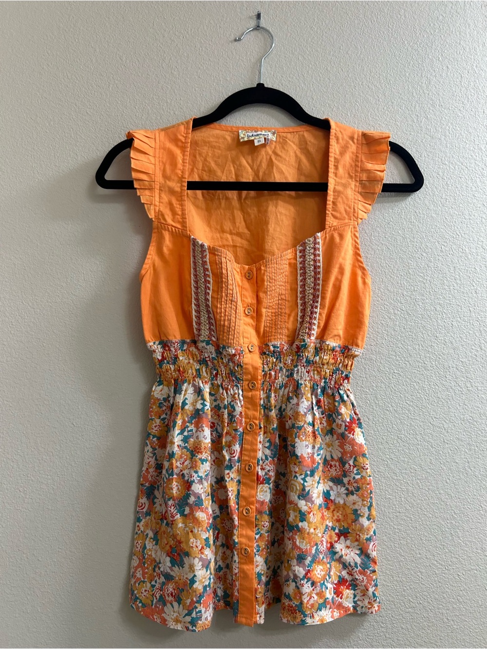 Lulumari Orange button front floral top with ruffle sleeves